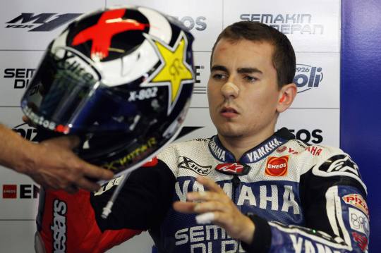 Lorenzo of Spain takes his helmet during the qualifying session of the Catalunya MotoGP Grand Prix in Montmelo
